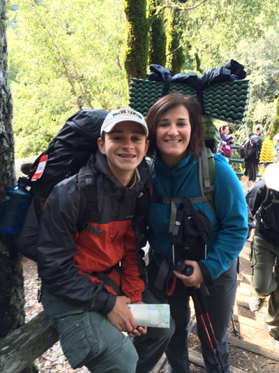 A picture of Ms. Frey and her teenage son on backpacking trip in Big Basin State Park, Santa Cruz, CA.